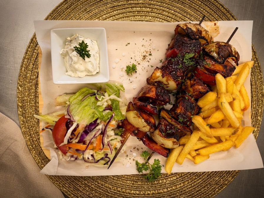 Grilled skewers with salad and fries